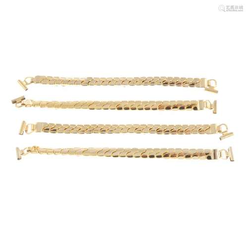 A bag of gold plated expandable watch bracelets. All