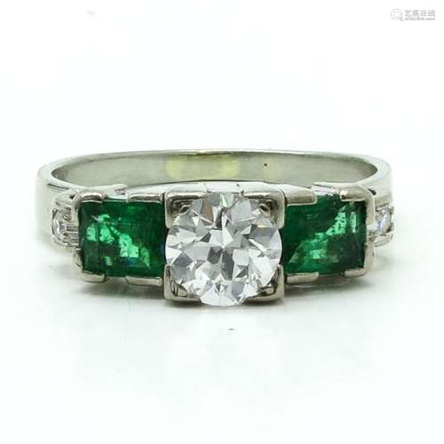 An 18KWG Ladies Diamond and Emerald Ring