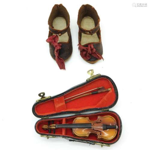 A Pair of Antique Jumeau Shoes and Miniature Violin