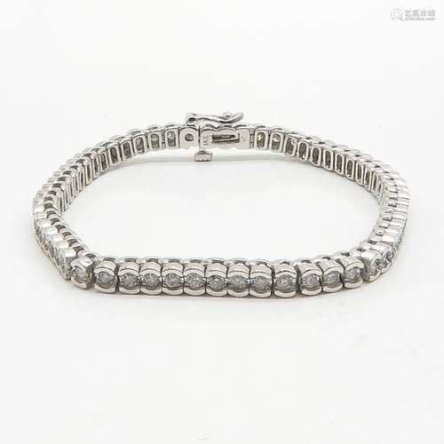 A 14KWG Ladies Diamond Tennis Bracelet