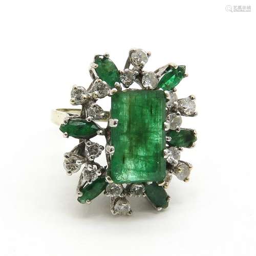 A Ladies White Gold Emerald and Diamond Ring