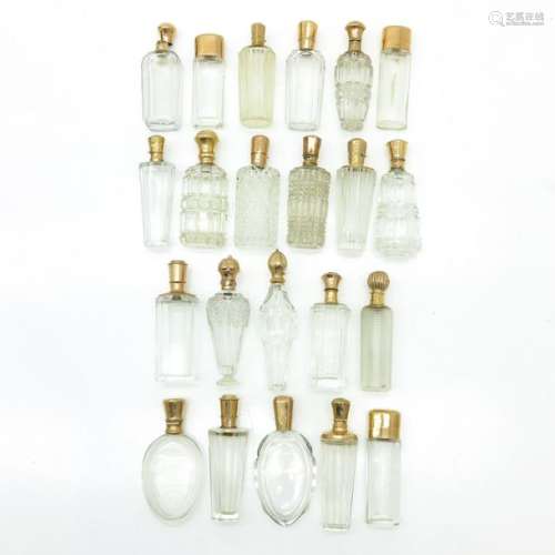 A Lot of 22 19th Century Perfume Bottles with Gold Tops
