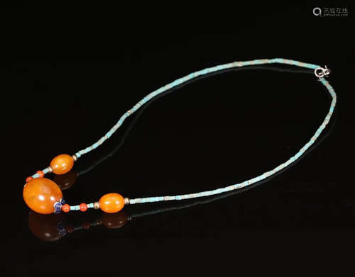 AN OLD AMBER MILA BEADS STRING NECKLACE