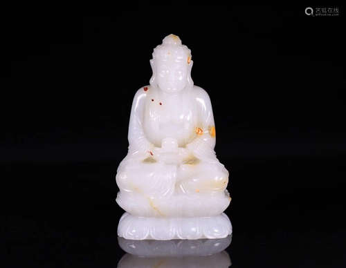 A HETIAN JADE SHAKYAMUNI BUDDHA FIGURE