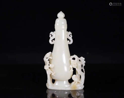 A HETIAN JADE VASE WITH PLUM BLOSSOM DESIGN