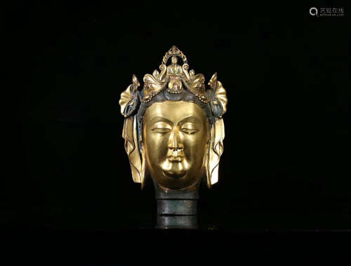 A COPPER GILT GUANYIN HEAD ORNAMENT