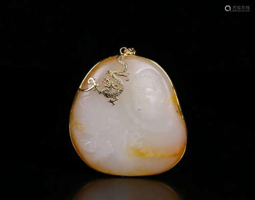 A HETIAN JADE CARVED SAKYAMUNI DESIGN PENDANT