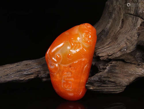 A HETIAN YELLOW STONE CARVED PENDANT