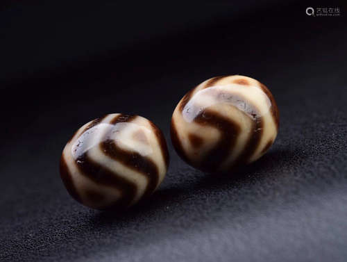 TWO TIBETAN DZI BEADS