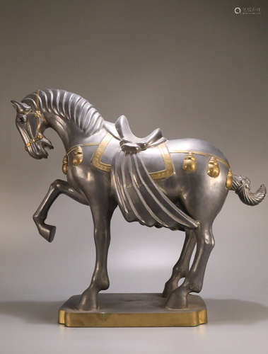 A TIN WITH COPPER HORSE SHAPED PENDANT