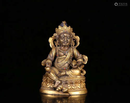 A GILT BRONZE HUANGCAISHEN BUDDHA