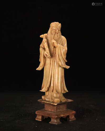 A SOAPSTONE CARVED IMMORTAL FIGURE