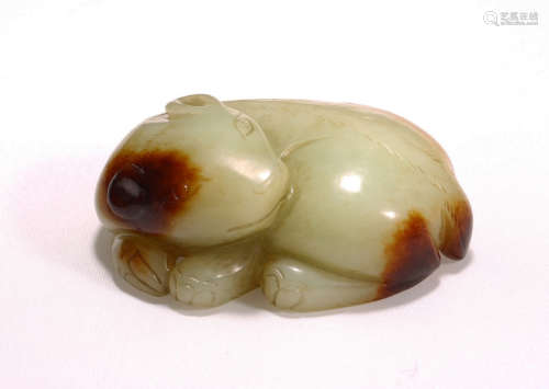 A YELLOW AND RUSSET JADE CARVING OF MYTHICAL BEAST