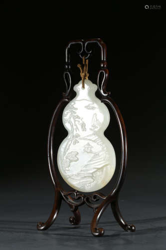 A WHITE JADE DOUBLE GOURD 'LANDSCAPE AND FIGURES' PENDANT