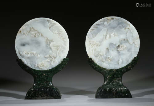 A PAIR OF JADE CARVED CIRCULAR 'LANDSCAPE' TABLE SCREENS