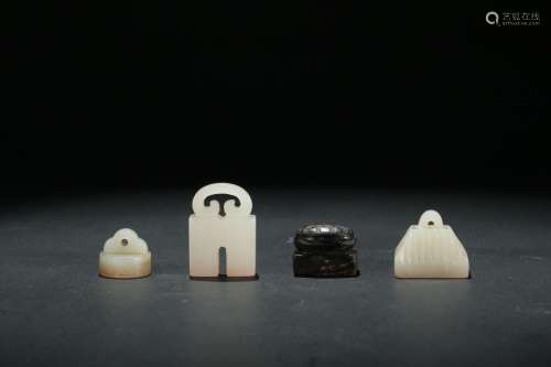 A GROUP OF FOUR CARVED JADE SEALS