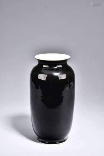 A BLACK GLAZED VASE