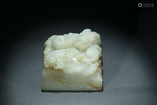 A WHITE JADE 'DRAGON' PAPER WEIGHT