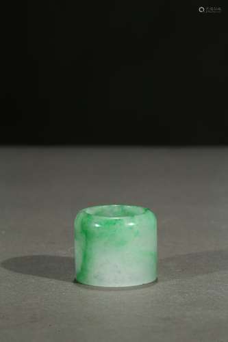 A JADEITE CARVED THUMB RING