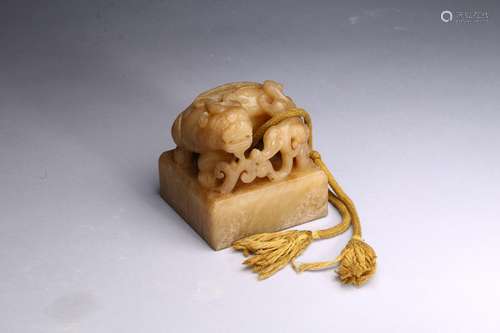 A CARVED JADE 'DRAGON' SEAL