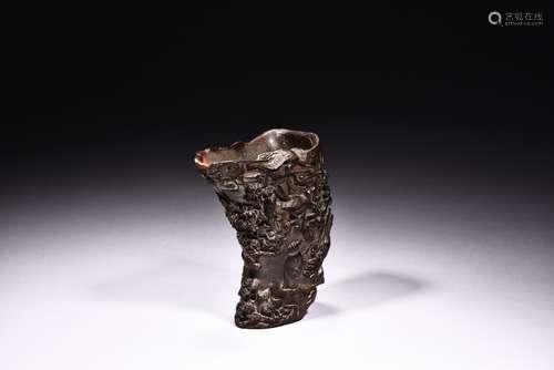 A HORN CARVED 'FIGURES AND LANDSCAPE' LIBATION CUP