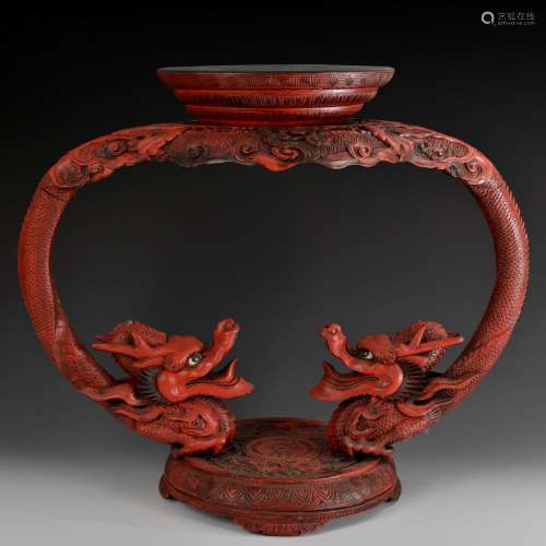 A CINNABAR LACQUER WOOD CARVED DRAGONS STAND