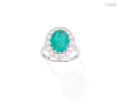 An emerald and diamond ring