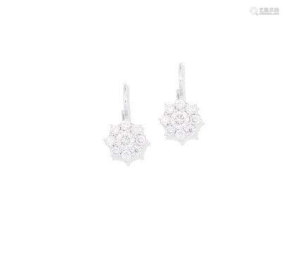 A pair of diamond cluster earrings