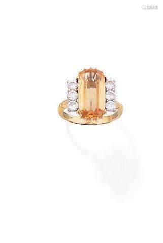 A topaz and diamond dress ring