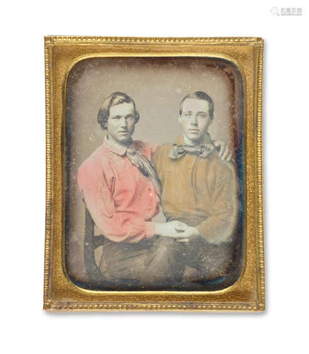 Tinted daguerreotype, 59 x 44 mm, depicting two men seated, one on the other's lap, holding hands and embracing. QUEER IDENTITY IN THE 19TH CENTURY.