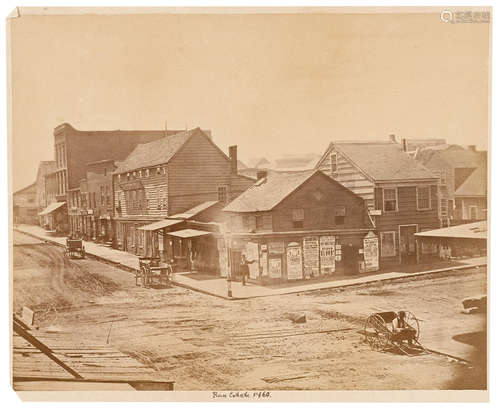 Imperial albumen print photograph, 7 1/2 x 9 1/2 inches SAN FRANCISCO: RUSS HOUSE WITH POSTED ADVERTISING BROADSIDES VISIBLE, 1860.