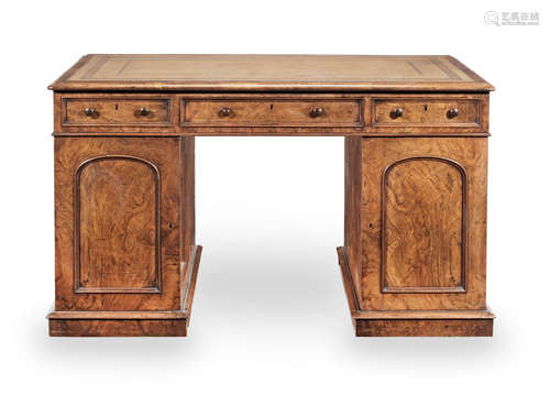 An early Victorian walnut pedestal desk retailed by Edwards and Roberts