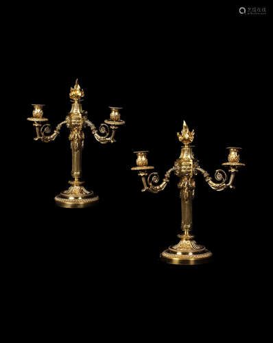 A pair of French late 19th century Louis XVI style gilt bronze three-light candelabra