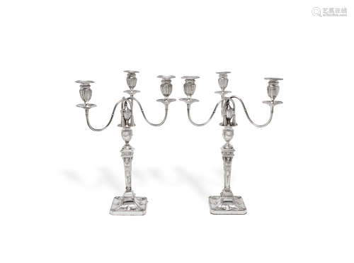 by John Swift, London 1777  (2) A pair of unusual George III silver three-branch candelabra