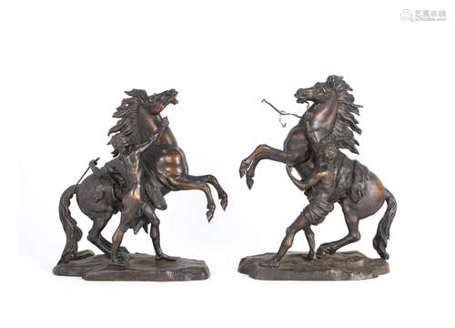 After Guillaume Coustou the elder (French, 1677-1746): A pair of late 19th / early 20th century French patinated bronze models of the 'The Marley Horses'