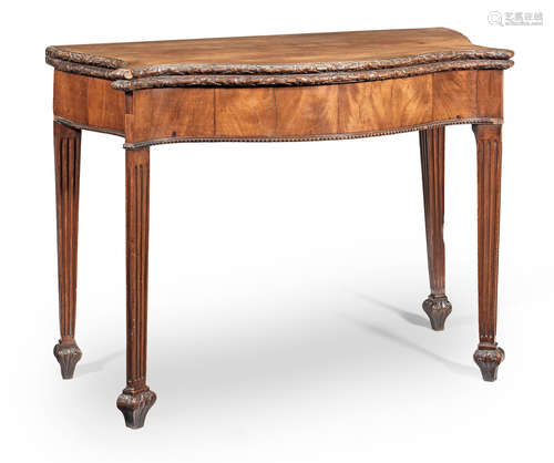 A George III carved mahogany serpentine card table