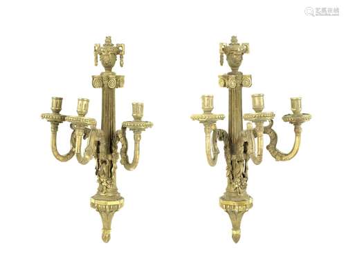 in the Louis XVI style A pair of 19th century gilt gesso and carved wood three light wall appliqués