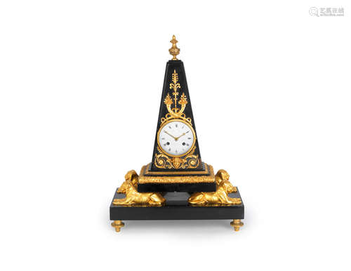 in the Egyptian taste, the dial signed Faizin a Paris A 19th century French gilt bronze mounted black marble obelisk clock