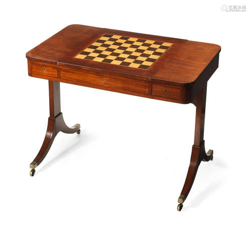 in the manner of Gillows A Regency mahogany and ebonised line-inlaid games/writing table