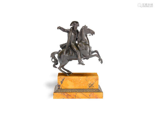 A late 19th century French patinated equestrian bronze model of Napoleon