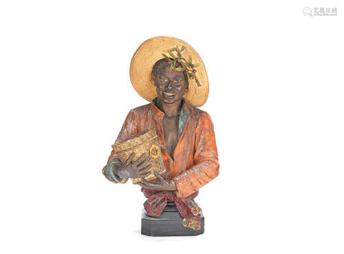 in the Goldscheider style An early 20th century Austrian painted terracotta bust of a black boy