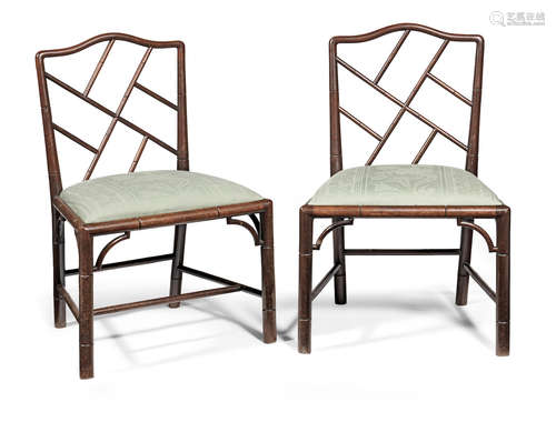 A pair of George III mahogany 'cockpen' side chairs