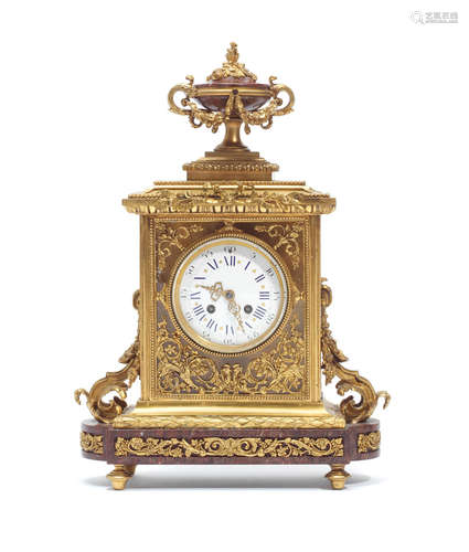 in the Louis XVI style, the movement stamped Charpentier and Japy Freres A late 19th century French gilt bronze and rouge marble mantel clock