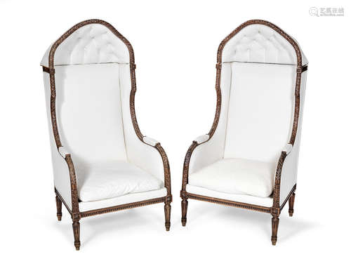 in the Louis XVI style A pair of French late 19th century carved stained beech porter's chairs