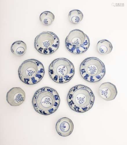 Kangxi tea service White and blue porcelain. Composed of eight faceted bowls decorated with hand-
