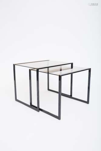 Belgo Chrome Set of two nested tables Black lacquered steel and gilded brass. Smoked glass table