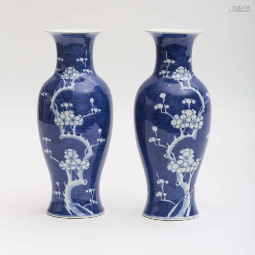 Pair of Chinese vases featuring cherry trees Porcelain with blue ground. Mark of concentric blue