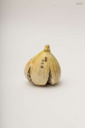 Okimono in the shape of a fig Carved and coloured ivory, bearing a signature and a seal. Japan,