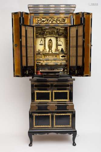 Large Butsudan altar Lacquered wood, with curved feet and lotus-patterned copper hinges. The centre