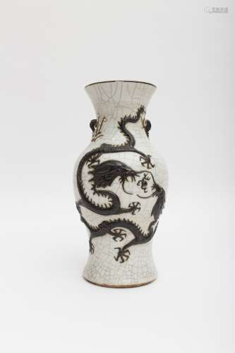 Large Guan stoneware baluster vase Featuring a dragon, cherry tree, and bird in black enamel.